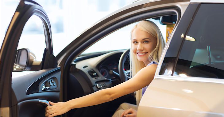 Young lady in a new car