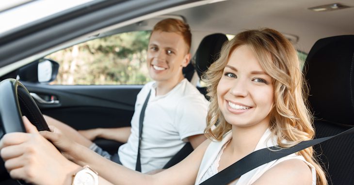 Young couple in their car