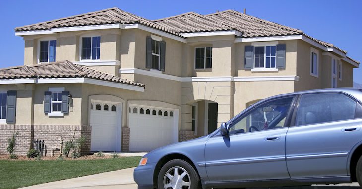 Suburban home with car in driveway