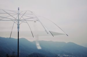 clear umbrella in mountains